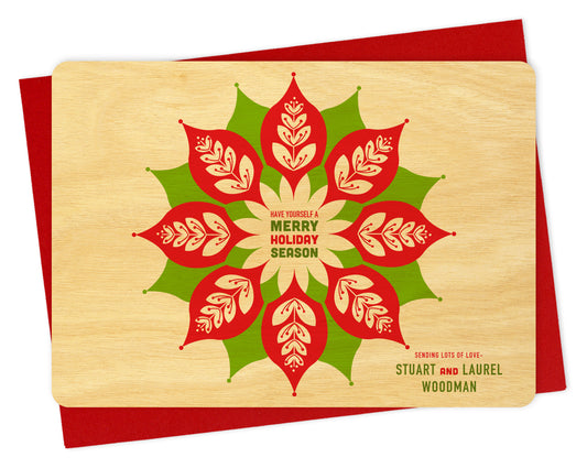 Customizable wood holiday card with red and green leaf design, "Have Yourself a Merry Holiday Season" greeting and a personal message on a birch wood background. Shown with a red envelope.