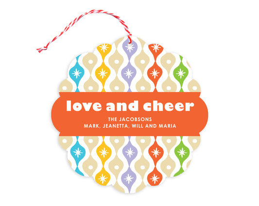 Front of customizable paper holiday ornament card featuring a colorful vintage ornament pattern, "love and cheer" text and a personal message. Round ornament with scalloped edges.