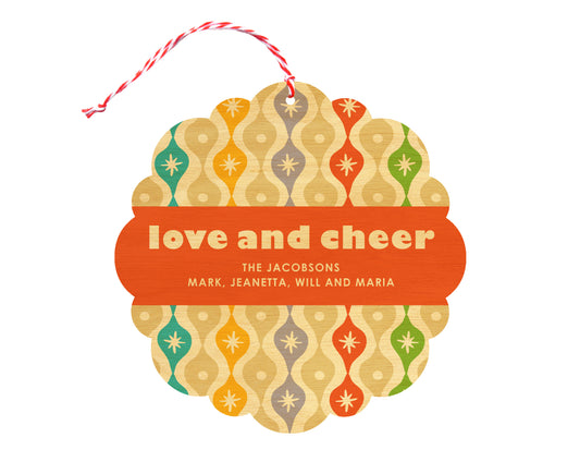 Front of customizable birch wood holiday ornament card featuring a colorful vintage ornament pattern "love and cheer" text and a personal message. Round ornament with scalloped edges.
