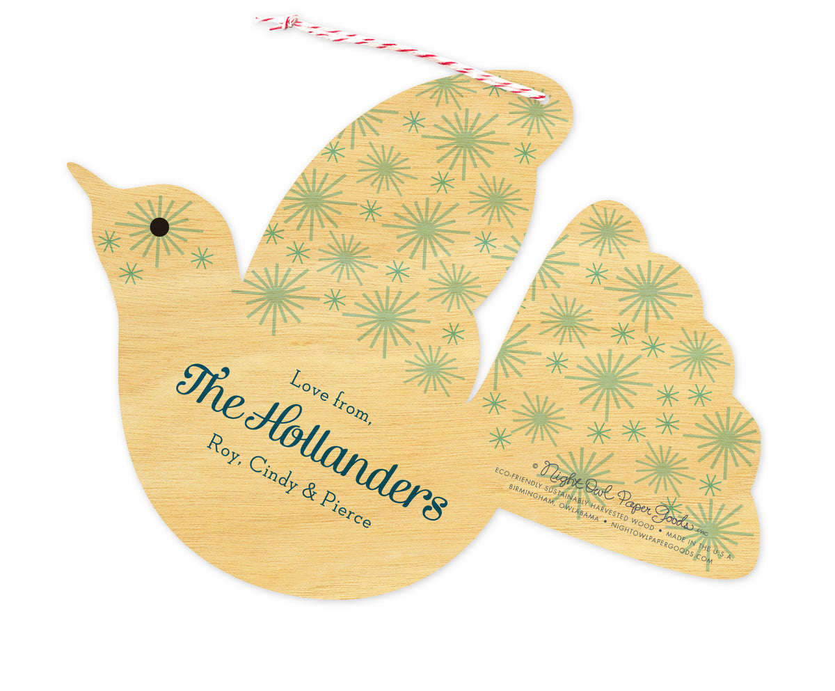 Back of personalized dove-shaped birch wood holiday ornament card with a personal greeting and a star pattern.