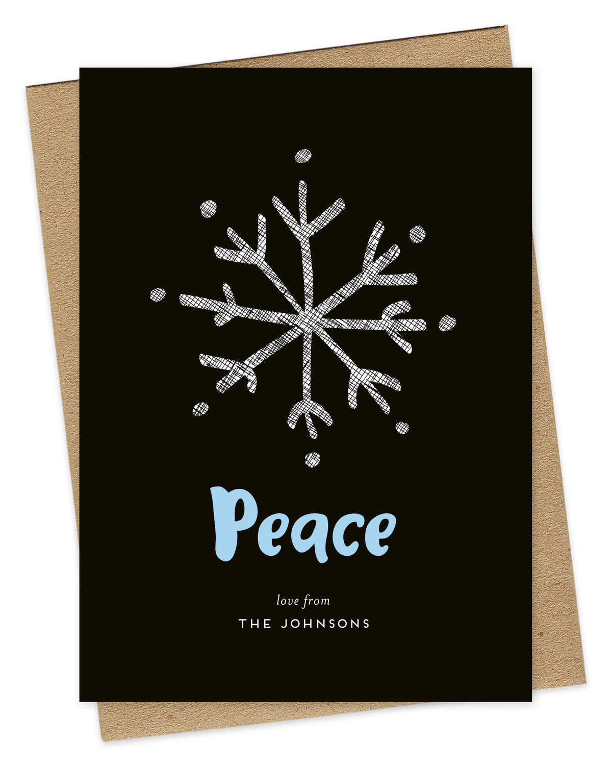 Customizable wood holiday card featuring a large illustrated snowflake, aqua "Peace” text and a personal greeting against a rich black backdrop. Shown with a kraft envelope.
