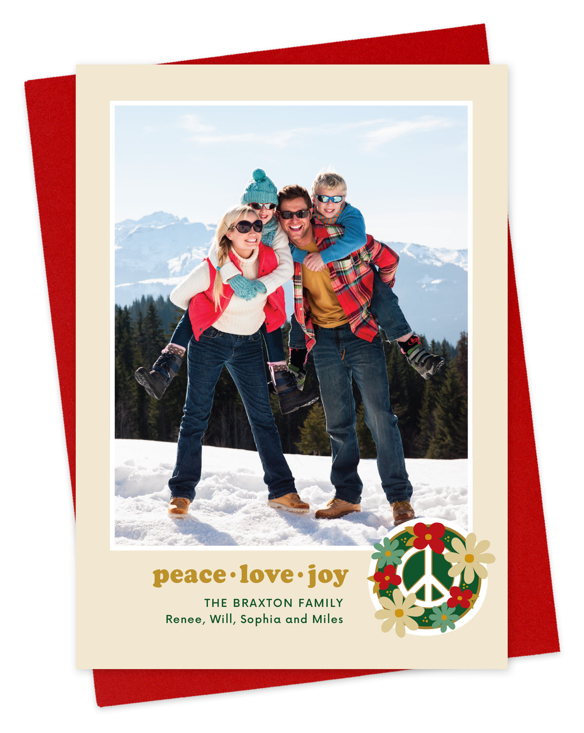 Customizable paper holiday card featuring a family photo with “peace love joy” text and a peace sign surrounded by flowers near the bottom, shown with a red envelope.
