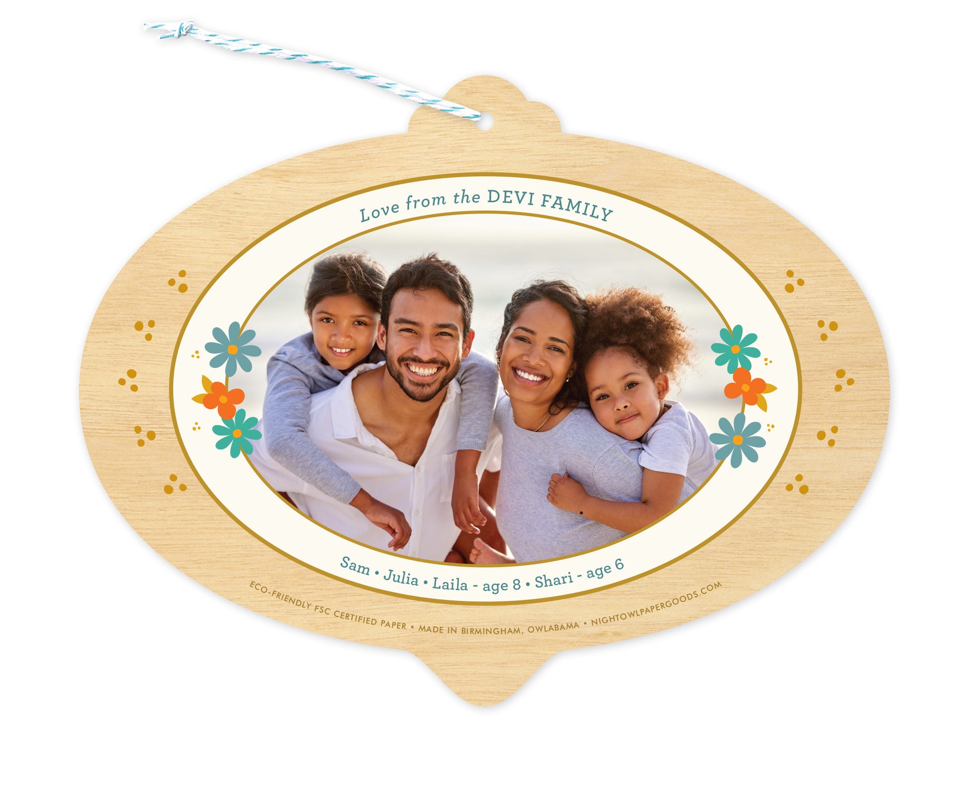 Back of customizable bulb-shaped paper holiday ornament card with Photo + Text Back option showing a personal photo and message accented by several small flowers.
