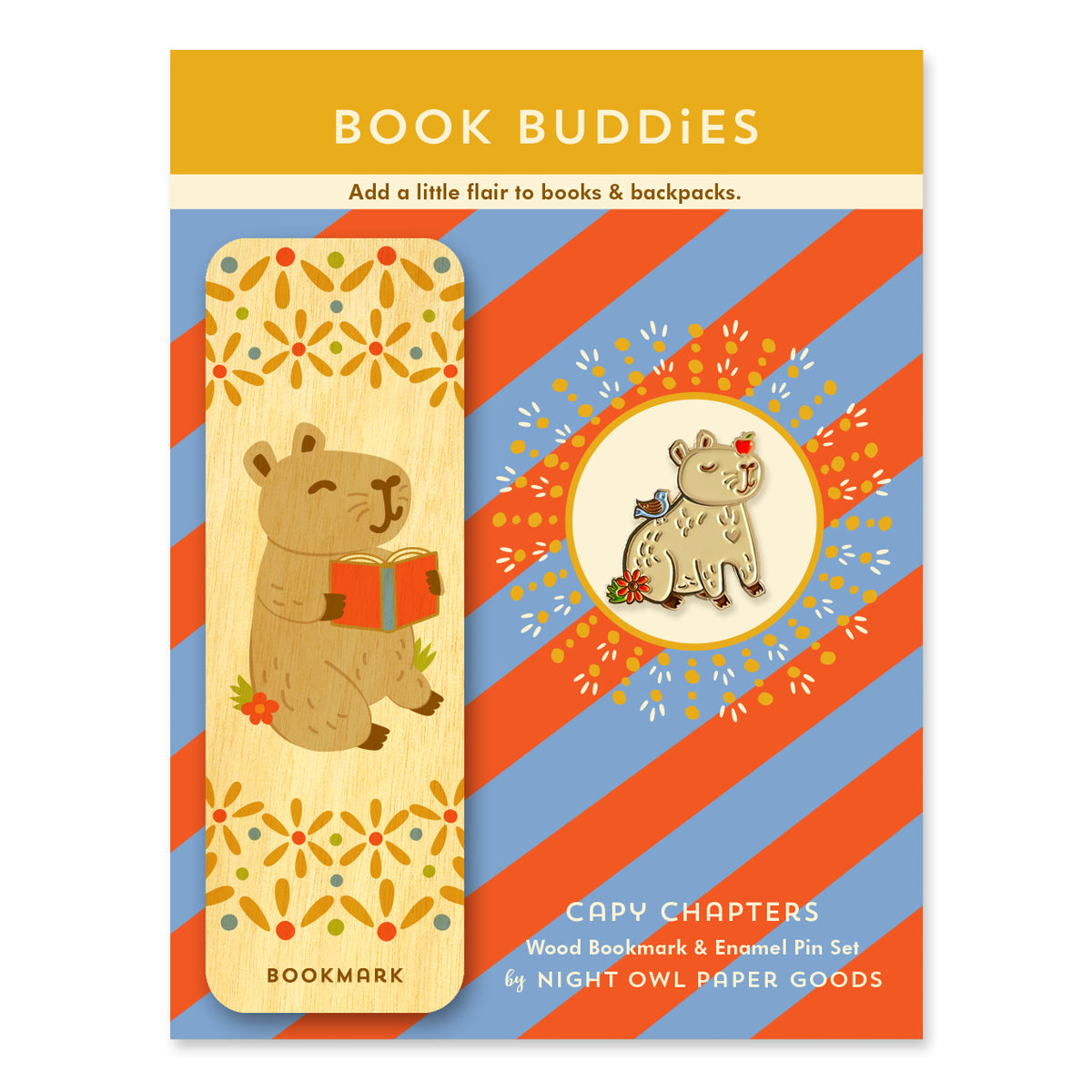 Capy Chapters Book Buddies wood bookmark and enamel pin gift set featuring a capybara holding a book on a wooden bookmark and a coordinating capybara enamel pin on a colorful striped backer card.