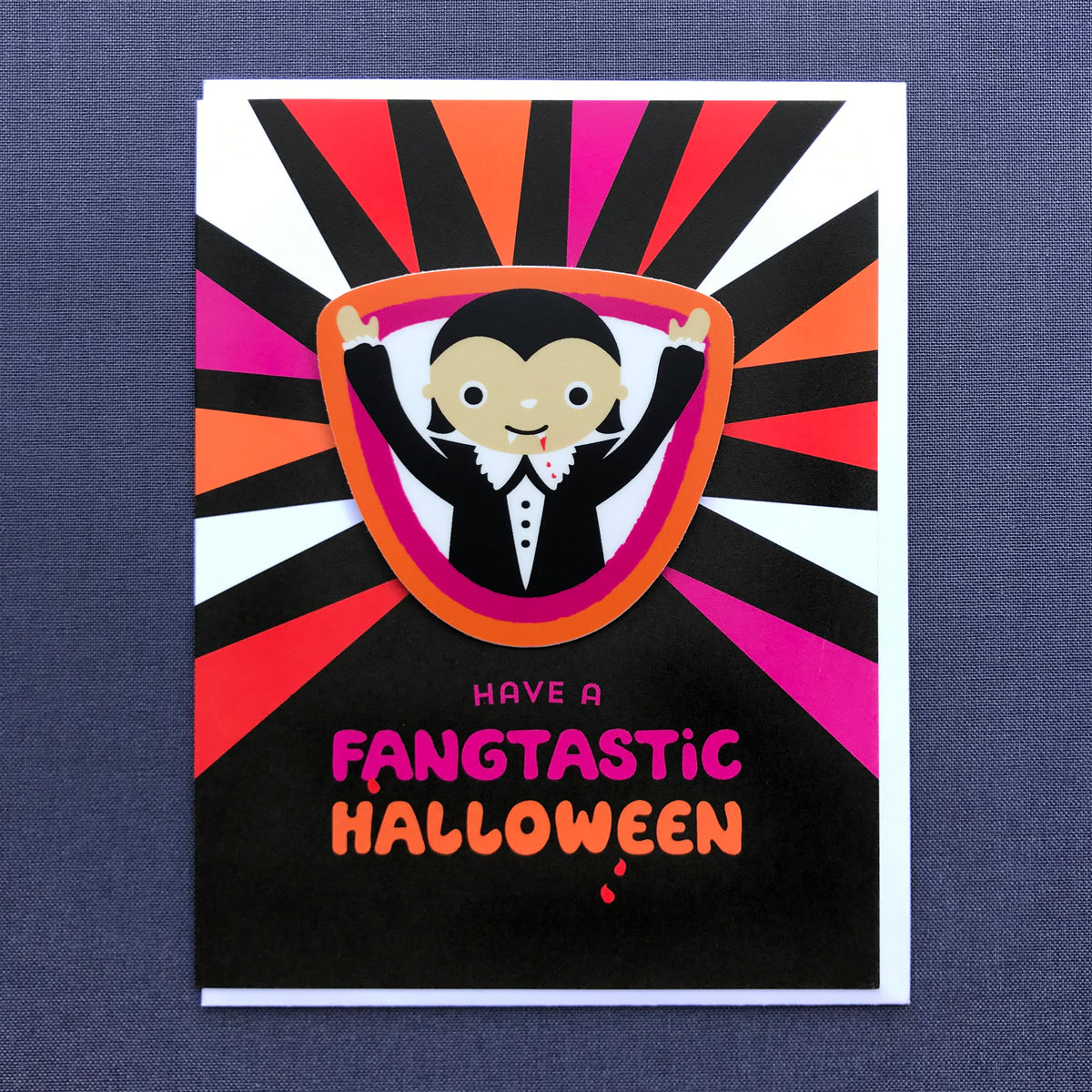 Halloween card with a cute vampire design on a sticker with 'Have a Fangtastic Halloween' text 