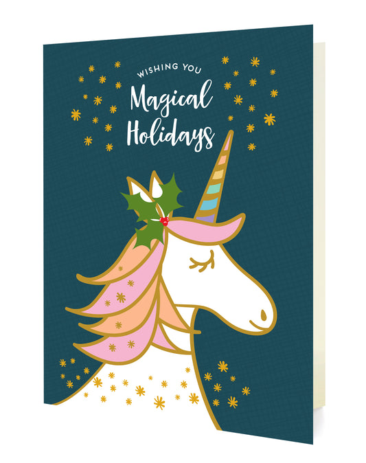 Front of folded holiday card featuring a whimsical unicorn with a pastel mane and holly on its head and “Wishing You Magical Holidays” text on a dark blue background sprinkled with gold stars.