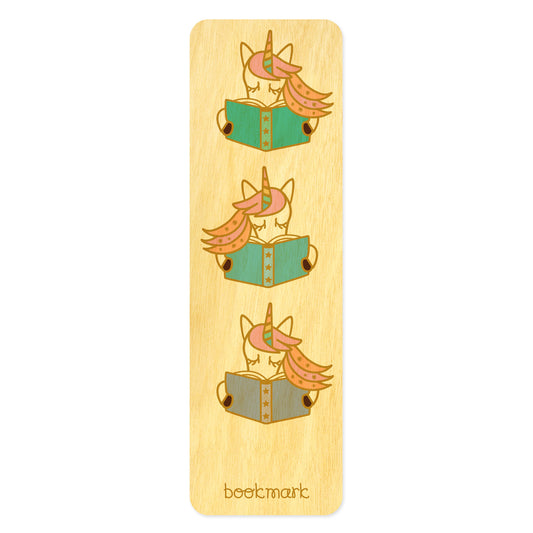 Wooden bookmark with cute pastel unicorns reading books. Text at bottom reads "bookmark."