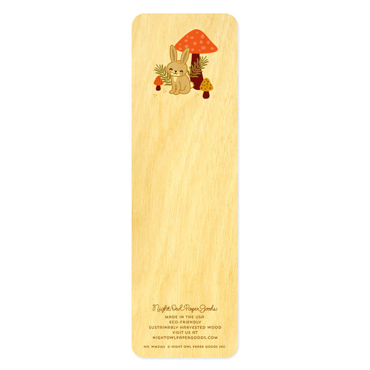 Back of birch wood bookmark with a rabbit and mushroom design. At the bottom: Night Owl Paper Goods script logo with text reading "Made in the USA - Eco-Friendly Sustainably Harvested Wood - Visit us at nightowlpapergoods.mom."