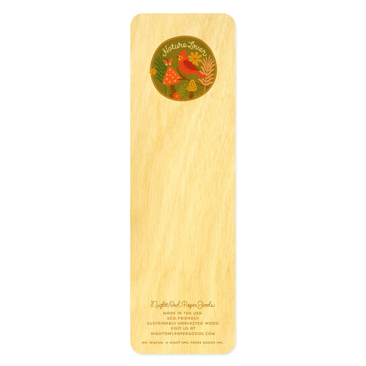 Back of birch wood bookmark with a red bird, flowers, butterfly and mushrooms in a circle surrounding the text "Nature Lover" in script handwriting. At the bottom: Night Owl Paper Goods script logo with text reading "Made in the USA - Eco-Friendly Sustainably Harvested Wood - Visit us at nightowlpapergoods.mom."