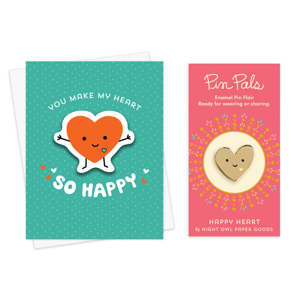 Happy Heart sticker card with removable red happy heart vinyl sticker and "You Make My Heart So Happy" text against an aqua background with small, faint polka dots. Shown alongside a gold Happy Heart enamel pin mounted on a pink backer card that reads "Pin Pals Enamel Pin Flair - Ready for wearing or sharing - HAPPY HEART by Night Owl Paper Goods"