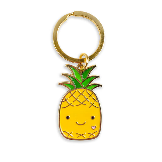 Gold metal pineapple enamel keychain with yellow smiling pineapple design and small heart detail on a gold key ring