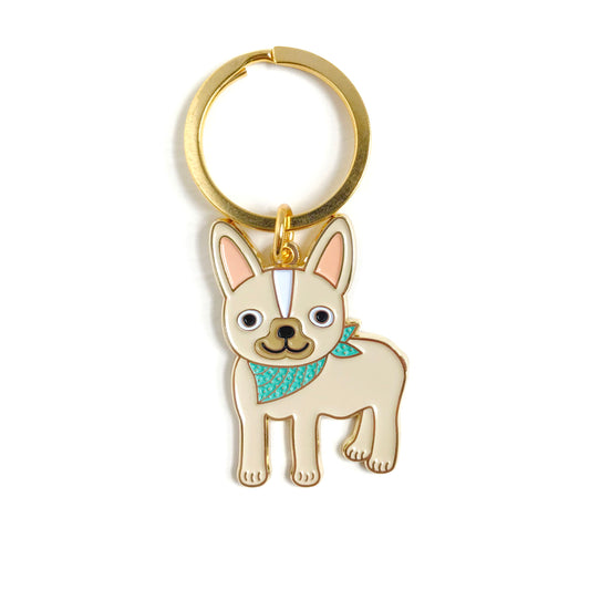 Gold metal French Bulldog enamel keychain featuring a cream colored Frenchie wearing a teal bandana on a gold key ring