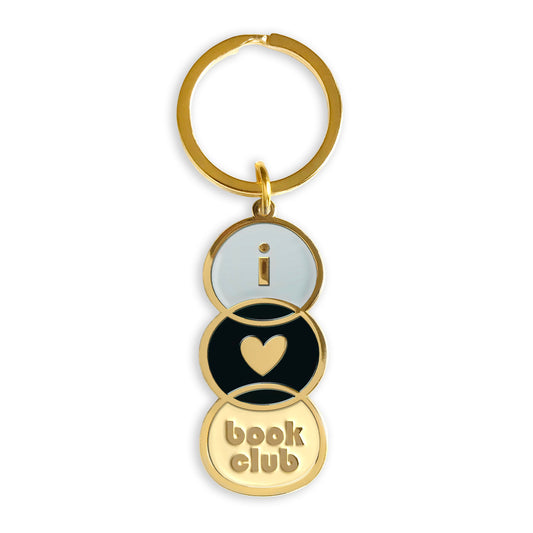 Gold metal Book Club enamel keychain featuring three stacked circles spelling "I heart book club" in light grey, black and cream enamel on a gold key ring