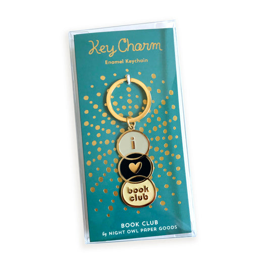 Book Club enamel keychain on gold foil stamped backer card packaged in a clear gift box. Teal backer card reads "Key Charm Enamel Keychain" at top and "Book Club by Night Owl Paper Goods" at bottom.