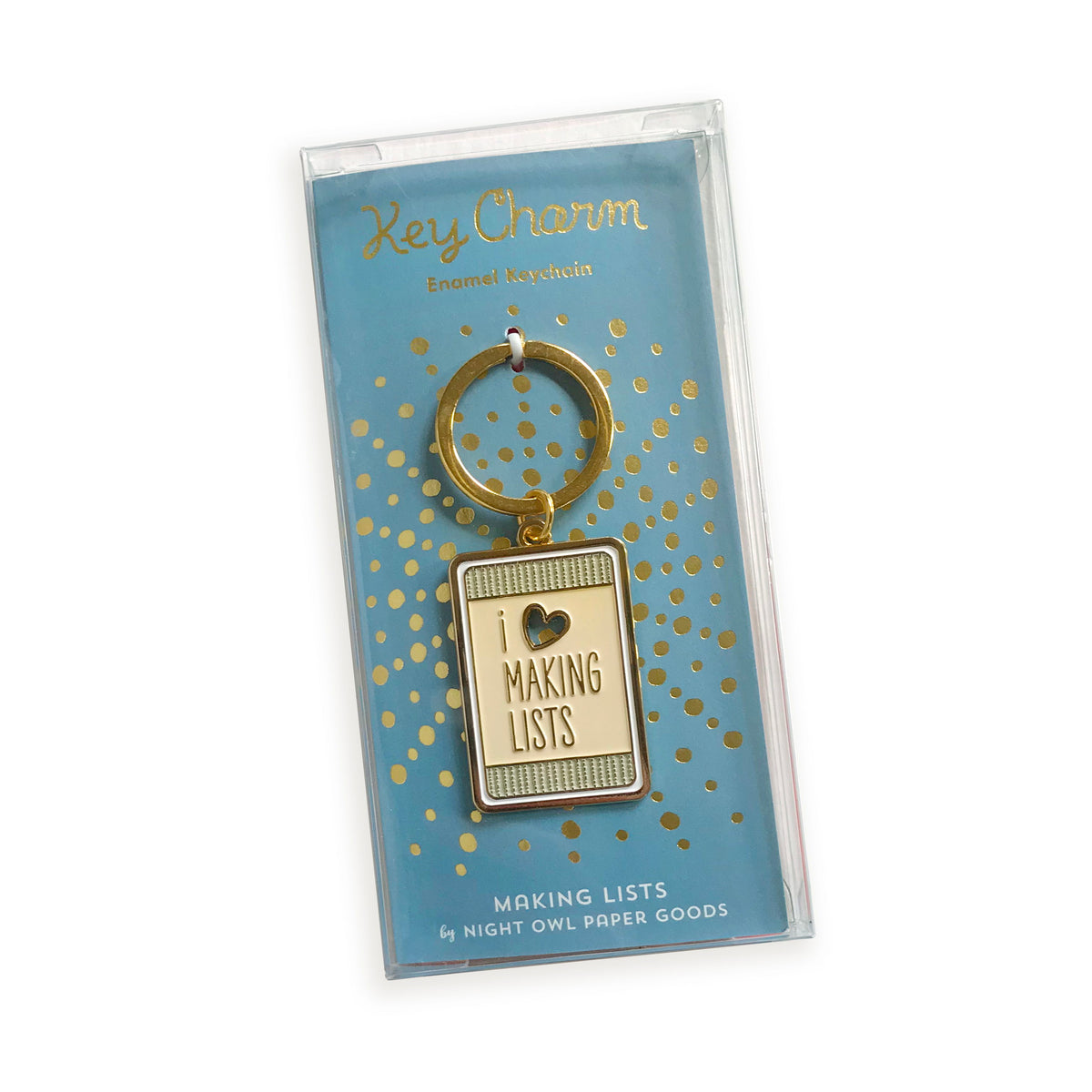 Making Lists enamel keychain on gold foil stamped backer card packaged in a clear box. Soft blue backer card reads "Key Charm Enamel Keychain" at top and "Making Lists by Night Owl Paper Goods" at bottom.