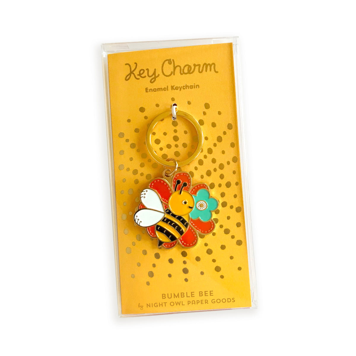 Bumble Bee enamel keychain on gold foil stamped backer card packaged in a clear gift box. Bold yellow backer card reads "Key Charm Enamel Keychain" at top and "Bumble Bee by Night Owl Paper Goods" at bottom.
