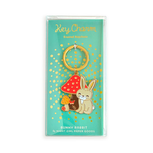 Bunny Rabbit enamel keychain on gold foil stamped aqua backer card packaged in a clear gift box. Backer card reads "Key Charm Enamel Keychain" at top and "Bunny Rabbit by Night Owl Paper Goods" at bottom.
