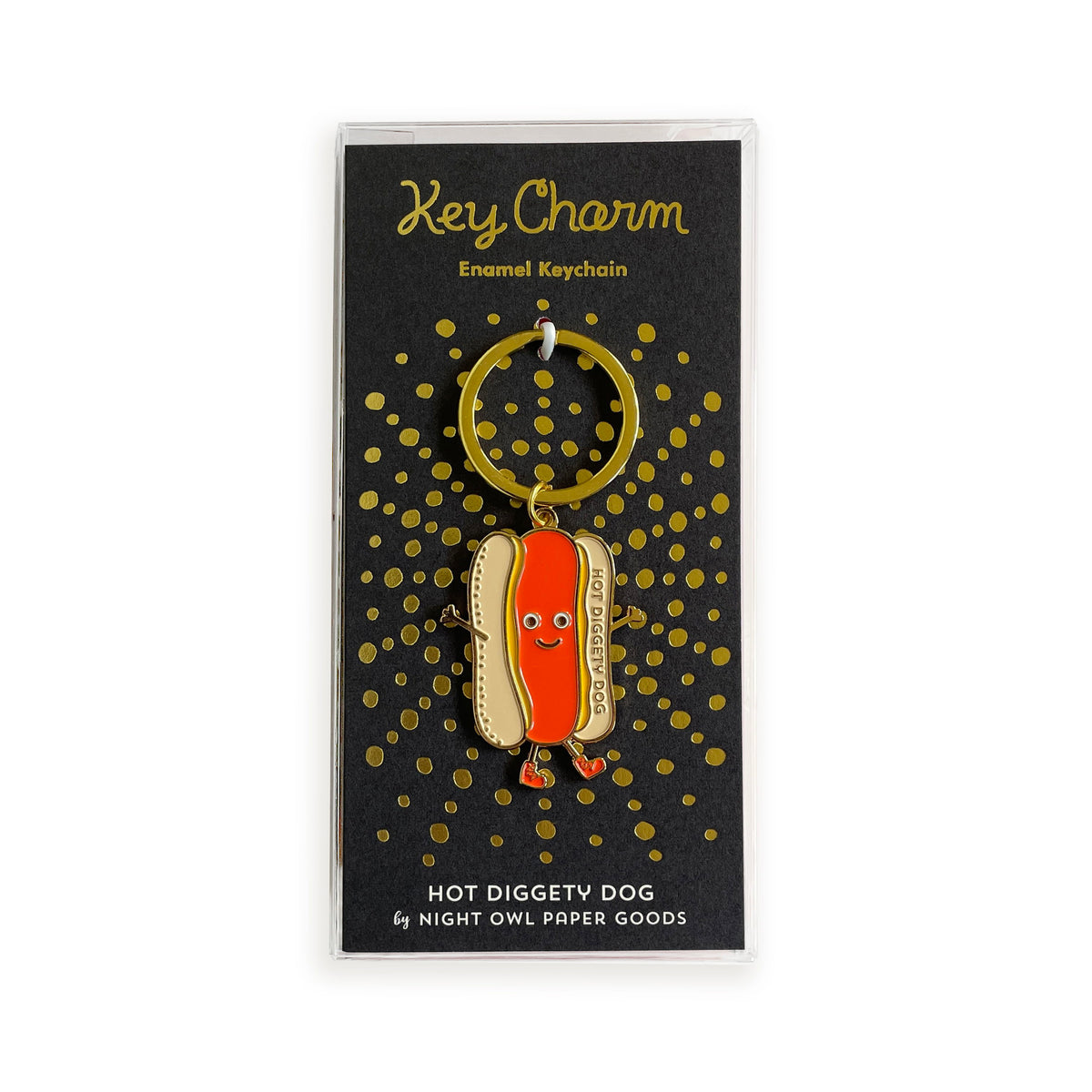 Hot Dog enamel keychain on gold foil stamped black backer card packaged in a clear gift box. Backer card reads "Key Charm Enamel Keychain" at top and "Hot Diggety Dog by Night Owl Paper Goods" at bottom.