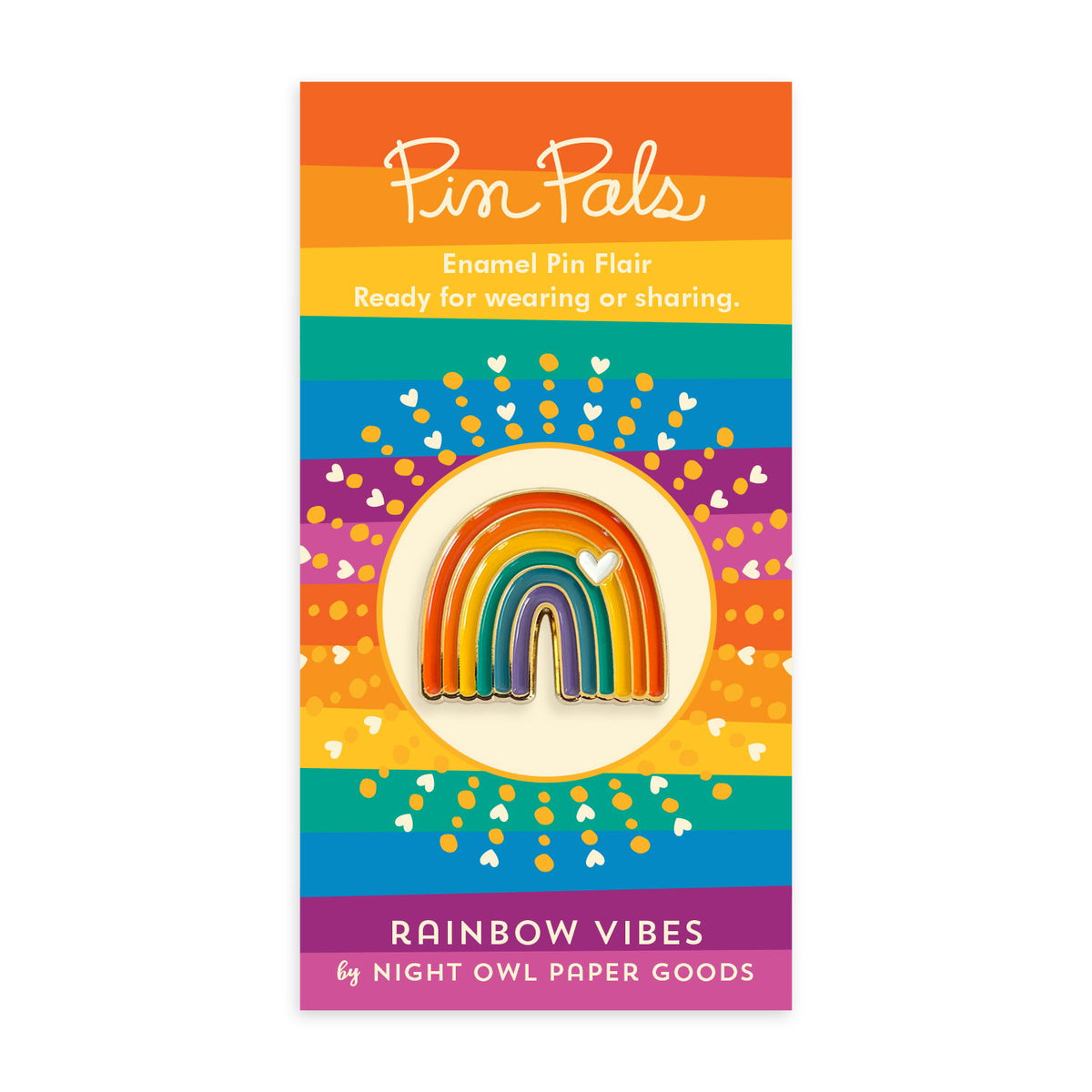 Rainbow enamel pin with a white heart and gold accents mounted on a rainbow striped backer card that reads "Pin Pals Enamel Pin Flair - Ready for wearing or sharing. RAINBOW VIBES by Night Owl Paper Goods."