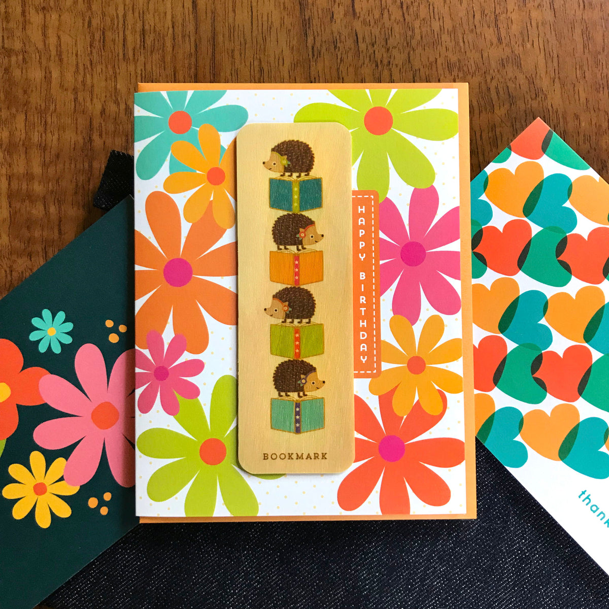 Reading Hedgehog Bookmark Birthday Card featured alongside colorful thank you cards with flowers and hearts.