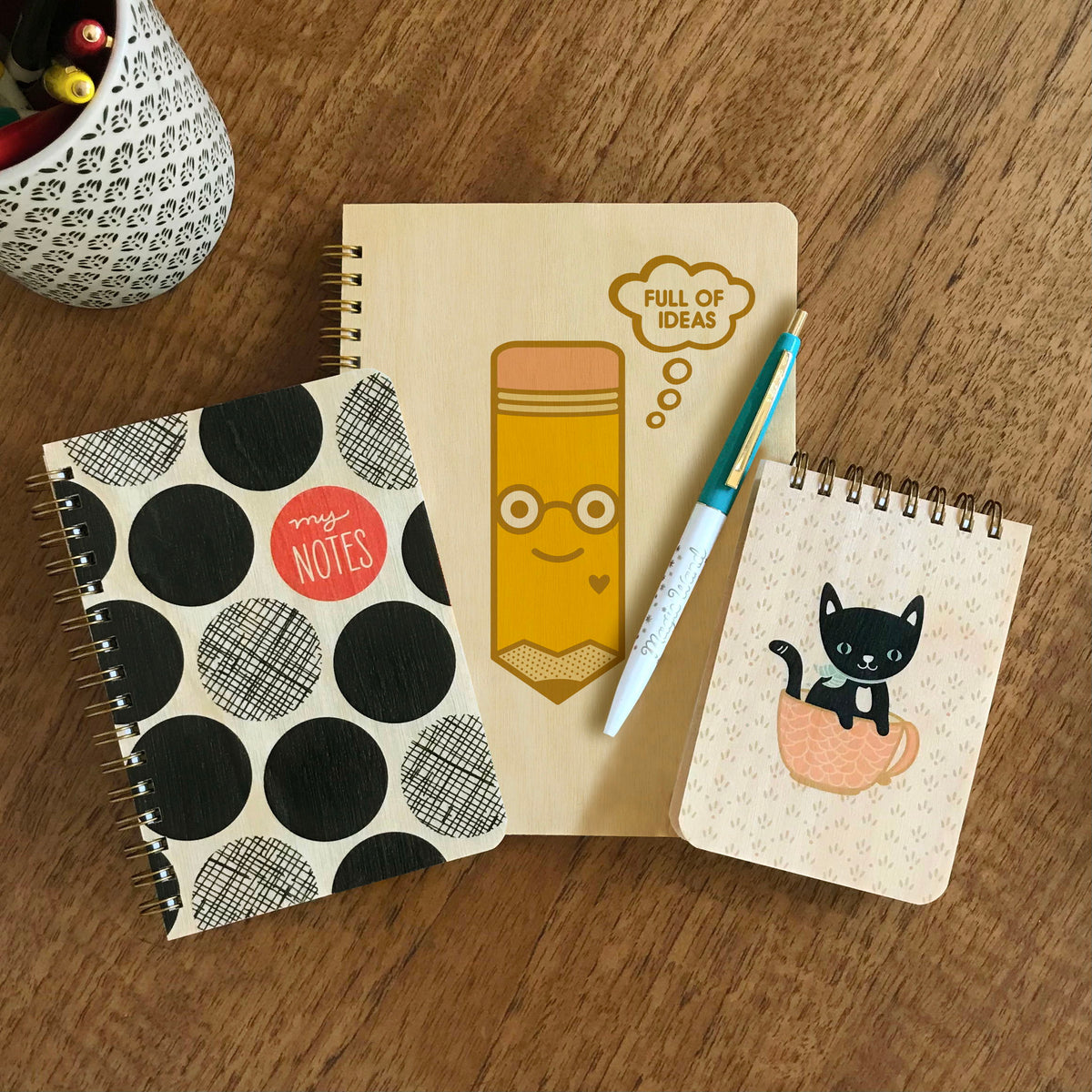 Big Dots Notes wood notebook, Idea Pencil wood journal, Magic Wand ballpoint pen and Cuppa Kitty wood mini notepad.
