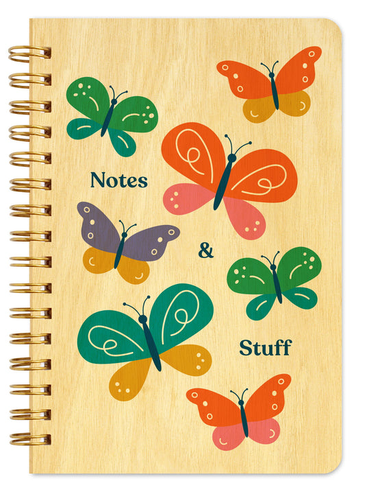 Spiral-bound wood notebook with birch wood covers featuring colorful butterflies in green, orange, teal and purple with "Notes & Stuff" text.