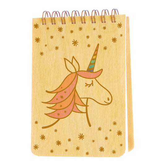 Spiral-bound wood mini notepad with birch wood covers featuring an enchanting unicorn with a flowing peach and pink mane and pastel rainbow-striped horn surrounded by scattered stars.