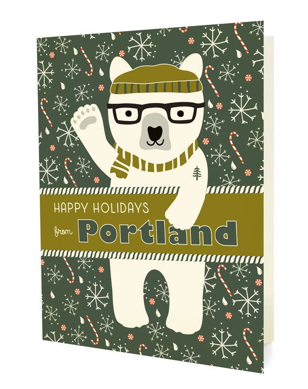 Polar Portland folded paper holiday card featuring a polar bear in black glasses and an olive striped beanie and scarf with a pine tree tattoo waving against a dark green background with snowflakes, raindrops and candy canes and the greeting "Happy Holidays from Portland"