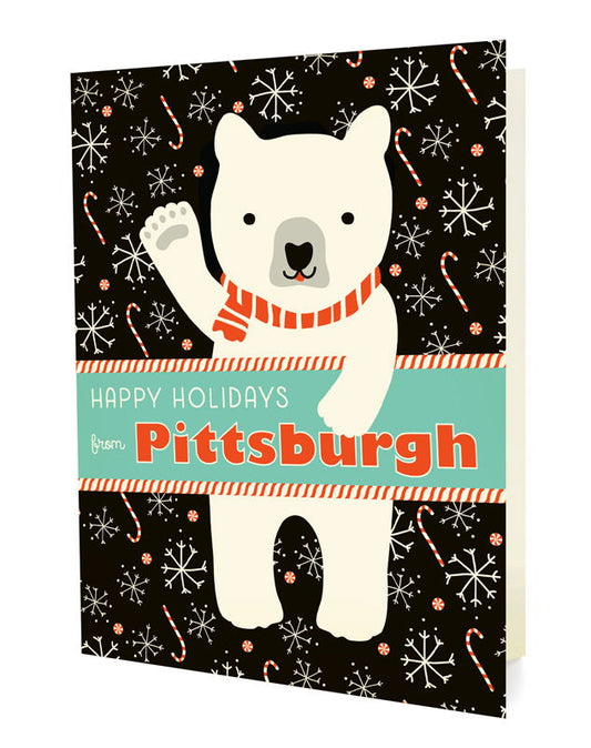 Polar Pittsburgh folded paper holiday card featuring a polar bear in a red striped scarf waving against a dark background with snowflakes and candy canes and the greeting "Happy Holidays from Pittsburgh"