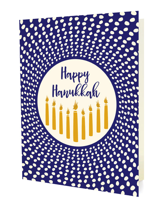 Radiant Hanukkah folded paper holiday card featuring nine gold Hanukkah candles on a cream circle against a bold blue dotted background with the greeting "Happy Hanukkah"