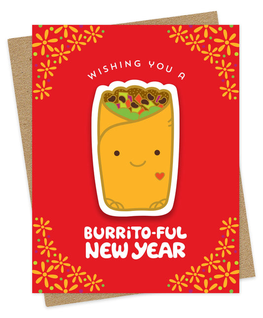 Burrito-Ful New Year Sticker Card featuring a removable vinyl burrito sticker on a bold red background with yellow flowers and the greeting "Wishing You a Burrito-Ful New Year". Shown with a kraft envelope.