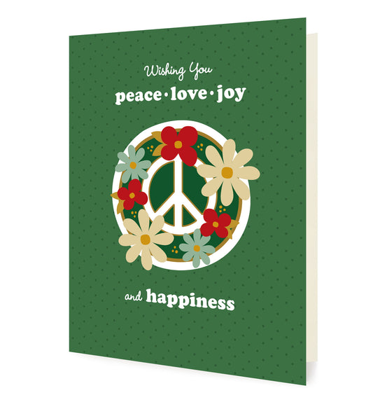 Blooming Peace Green folded paper holiday card featuring a green peace sign surrounded by red, cream and teal flowers on a soft green dotted background with the greeting "Wishing You peace, love, joy and happiness"
