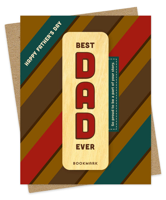 Folded Father's Day card with a bold retro diagonal stripe pattern in gold, brown, red and teal, with a Happy Father's Day banner accent and So proud to be a part of your story text. It includes a removable birch wood bookmark with Best Dad Ever text. Pictured with a kraft envelope.