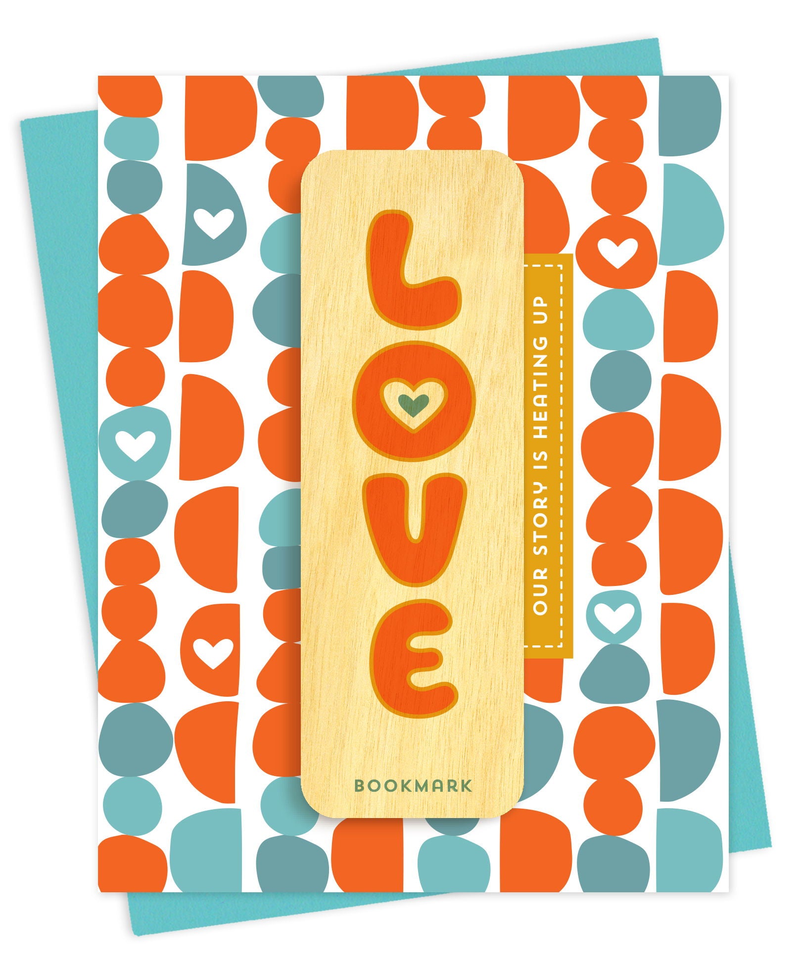 Folded love card with a bold geometric pattern in orange and teal with heart details, Our Story Is Heating Up text and a removable birch wood bookmark spelling out LOVE in retro bubble letters. Pictured with a teal envelope.