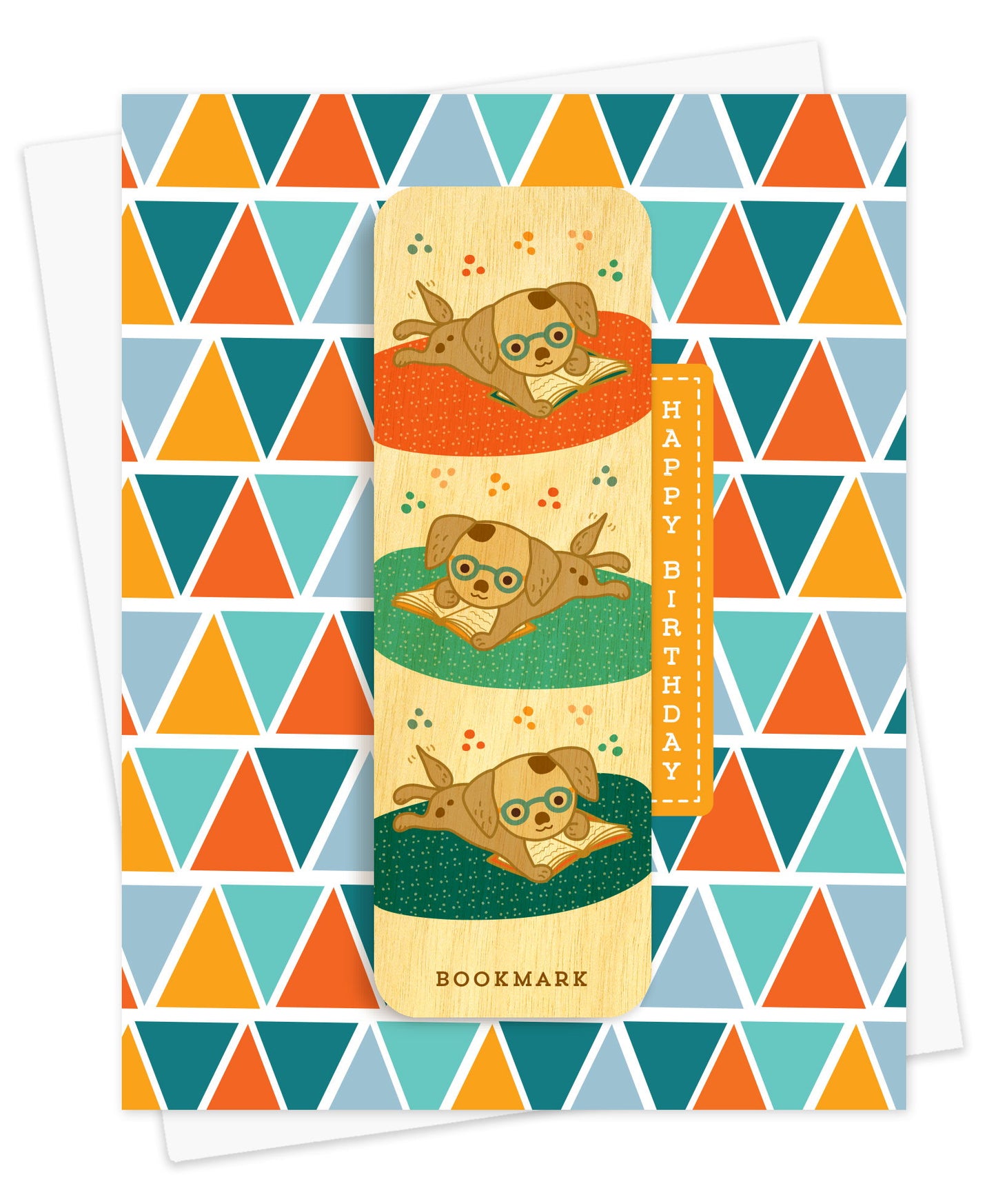 Folded birthday greeting card with a bold geometric triangle pattern in teal orange and gold, Happy Birthday text and a removable birch wood bookmark featuring illustrated puppies wearing glasses and reading books. Pictured with a white envelope.