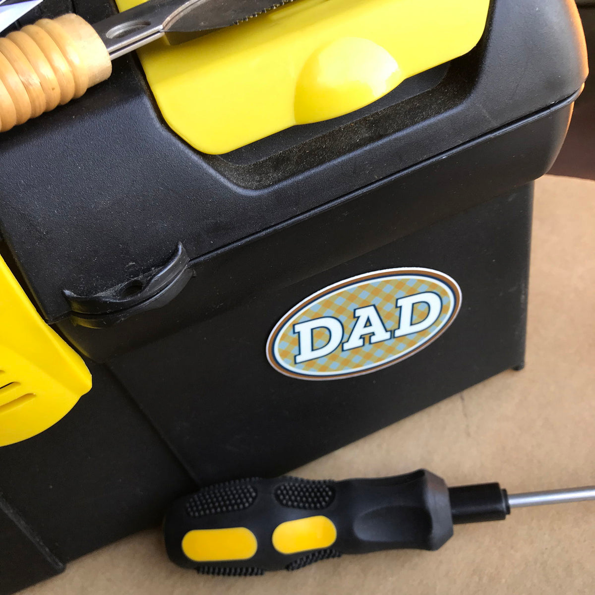 DAD vinyl sticker applied to a black tool box, showing it in use.
