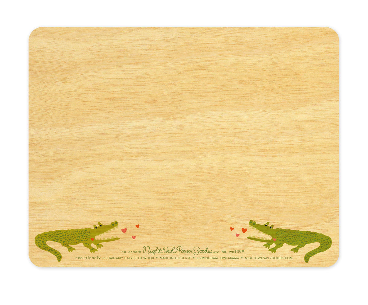 Back of No Croc wood love card, which is predominantly blank for a handwritten personal greeting. Along the bottom are two small crocodiles, the company logo and text that reads "eco-friendly sustainably harvested wood - made in the usa - birmingham, owlabama - nightowlpapergoods.mom"