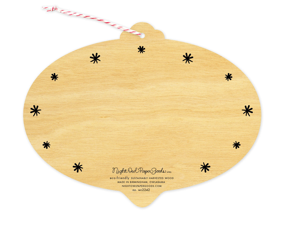 Back of Burst of Joy wood holiday ornament card, which is die-cut in the shape of a bulb and features black star design elements on the edges and space to write a personal greeting. Along the bottom is the company logo and text that reads "eco-friendly sustainably harvested wood - made in  birmingham, owlabama - nightowlpapergoods.mom"