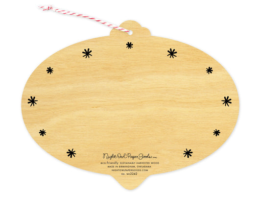 Back of Burst of Joy wood holiday ornament card, which is die-cut in the shape of a bulb and features black star design elements on the edges and space to write a personal greeting. Along the bottom is the company logo and text that reads "eco-friendly sustainably harvested wood - made in  birmingham, owlabama - nightowlpapergoods.mom"
