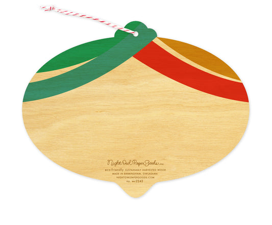 Back of Merry Bulb wood holiday ornament card, which is die-cut in the shape of a bulb and features swag design elements on top and space to write a personal greeting. Along the bottom is the company logo and text that reads "eco-friendly sustainably harvested wood - made in  birmingham, owlabama - nightowlpapergoods.mom"