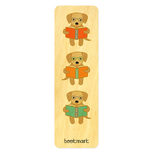 Wooden bookmark with illustrations of golden retriever dogs wearing eyeglasses reading books. Text at bottom reads "bookmark."