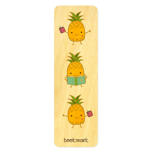 Wood bookmark with cute illustrations of a happy pineapple reading and holding books. Text at bottom reads "bookmark."