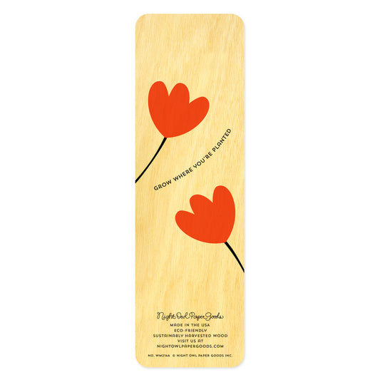 Back side of wooden bookmark with red tulip design text reads 'Grow where you're planted.' At the bottom: Night Owl Paper Goods script logo with text reading "Made in the USA - Eco-Friendly Sustainably Harvested Wood - Visit us at nightowlpapergoods.mom."

