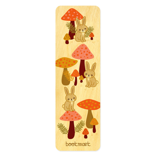 Birch wood bookmark featuring rabbits and mushrooms. Text at bottom reads "bookmark."