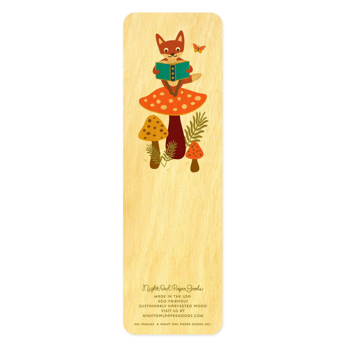 Back of birch wood bookmark featuring a fox sitting on a large mushroom reading a book. At the bottom: Night Owl Paper Goods script logo with text reading "Made in the USA - Eco-Friendly Sustainably Harvested Wood - Visit us at nightowlpapergoods.mom."