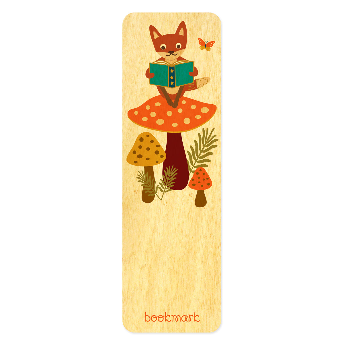 Birch wood bookmark with fox sitting on a big mushroom reading a book. Text at bottom reads "bookmark." 