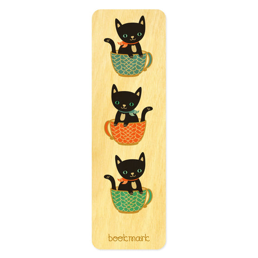 Birch wood bookmark featuring three black cats peeking out of colorful cups. Text at bottom reads "bookmark." 