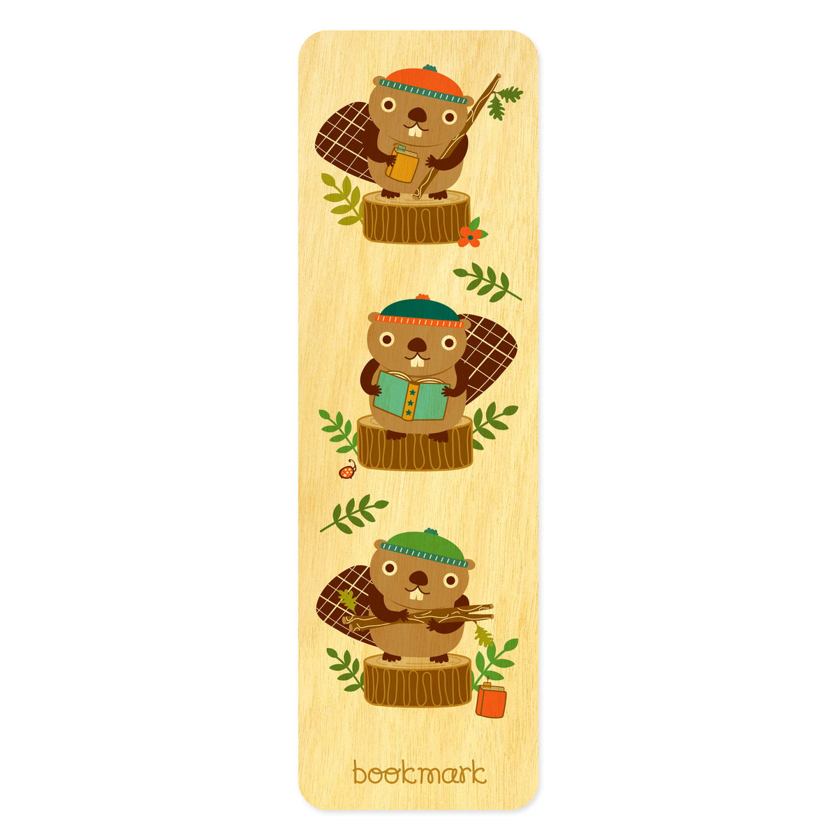 Birch wood bookmark with three cute beavers with books wearing stocking hats standing and sitting on tree stumps. Text at bottom reads "bookmark."